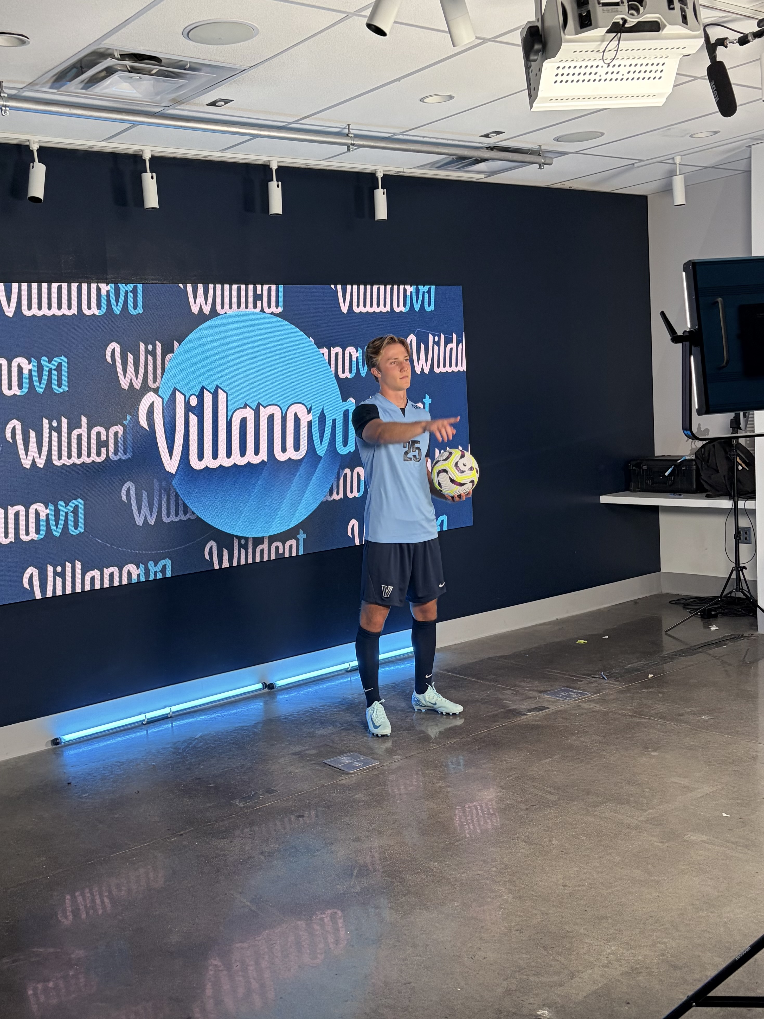 Gleb Bogdanov holding a soccer ball at Villanova media day