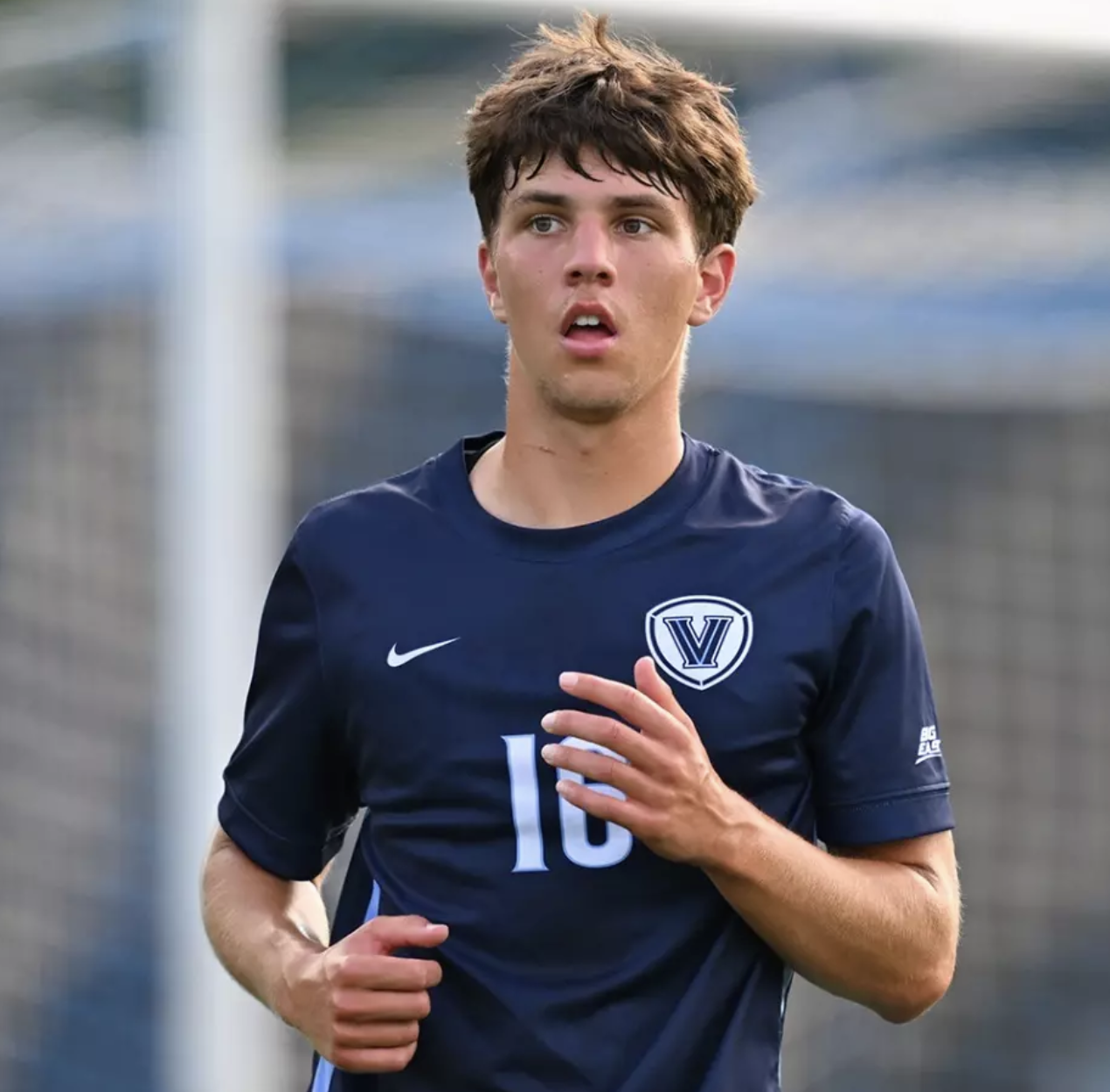 Joshua Rairick playing in his navy Villanova number 16 jersey